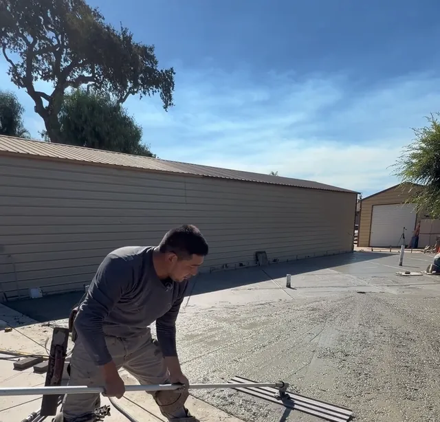 Checking a concrete slab with a straightedge